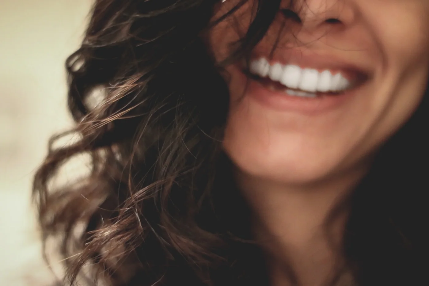 A woman smiling with an even, natural-looking smile